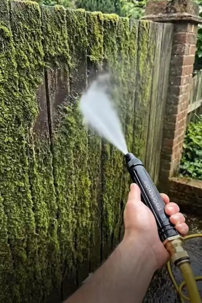 Pressure washer removing dirt, moss, mud, and ant nests from garden paths and outdoor surfaces